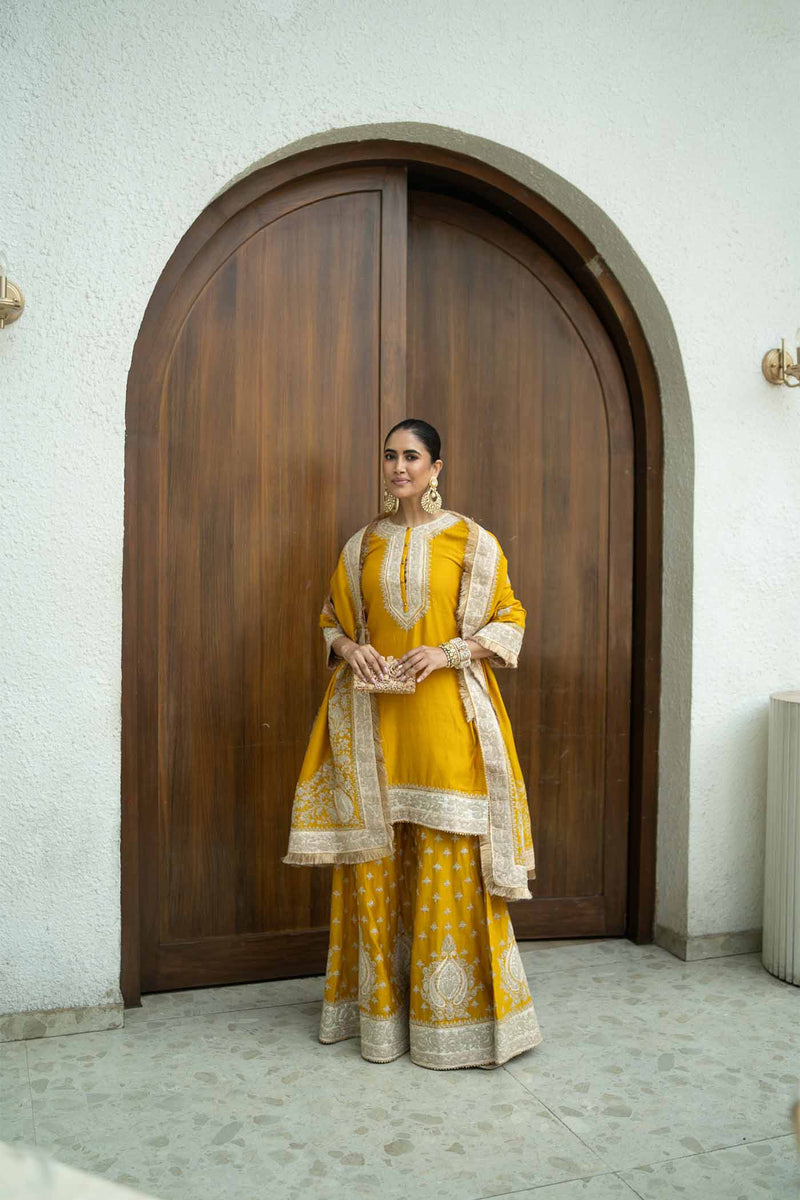 Alisha Pekha In RAINA - Glaze Mustard SHORT KURTA WITH SHARARA AND ODHNI